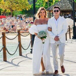 Custom made wedding dress.  Wore once for 30 minutes. Professionally cleaned.